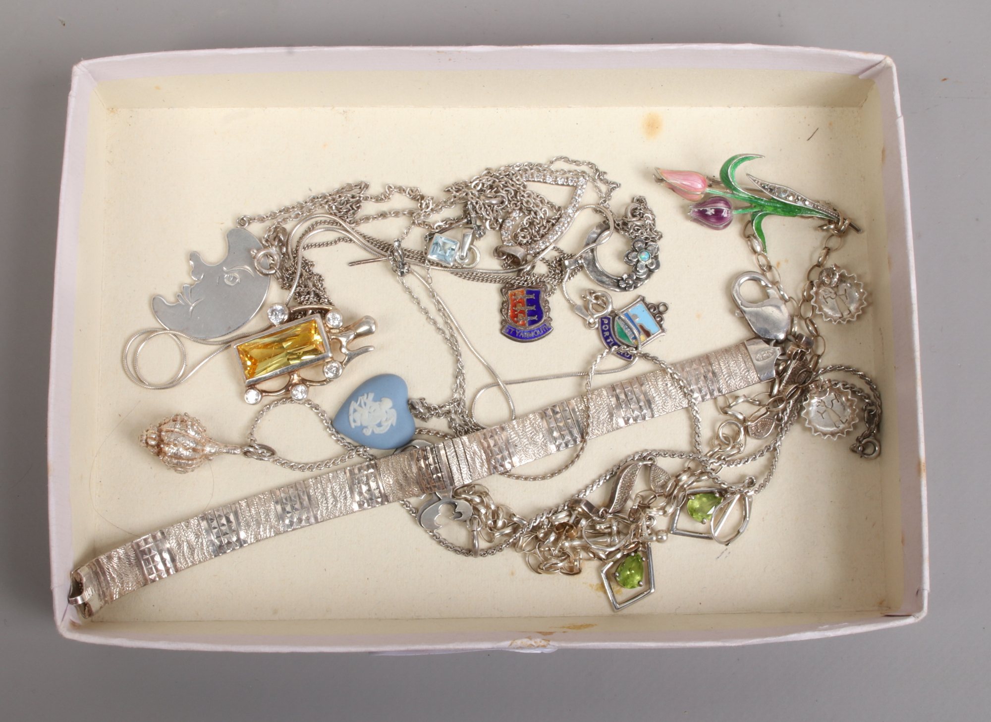 A quantity of silver jewellery and collectables including enamel fobs, a heart shaped Wedgwood