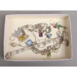 A quantity of silver jewellery and collectables including enamel fobs, a heart shaped Wedgwood