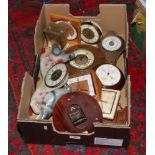 A box of wall clocks and barometers and a pottery mounted clock formed as a pair of pigeons.
