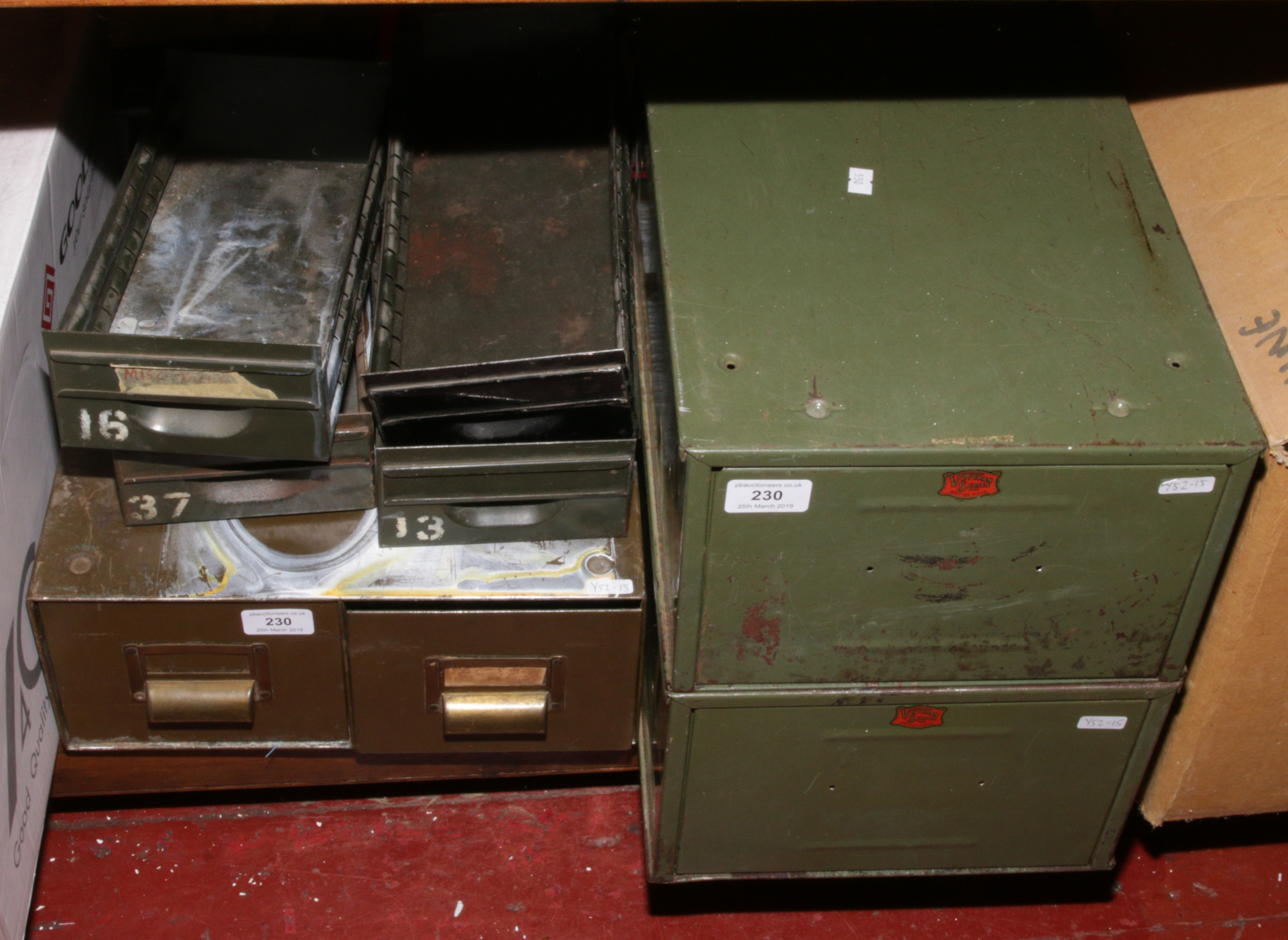 Three small vintage metal filing cabinets including two Veteran Series examples (lacking handles)