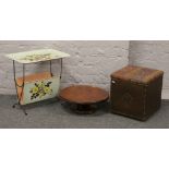 Three pieces of occasional furniture to include enamel magazine rack, oak Lazy Susan and a storage