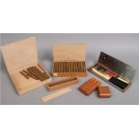 A box of 25 Soesters cigars, along with a collection of related items to include holder, cutters