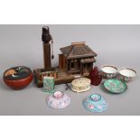 A group of oriental collectables including a Japanese table lamp formed as a house, Cantonese enamel