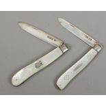 Two silver folding fruit knives with mother of pearl scales, assayed Sheffield 1897 and 1913.