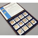 Twelve cased Benelux Muntkantoor Goede gilt Ecu coins, some duplicates.