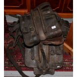 Two pieces of leather shirehorse tack, along with a saddle.