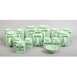 A large quantity of vintage Bristol kitchen ware storage jars with mint green ground and black