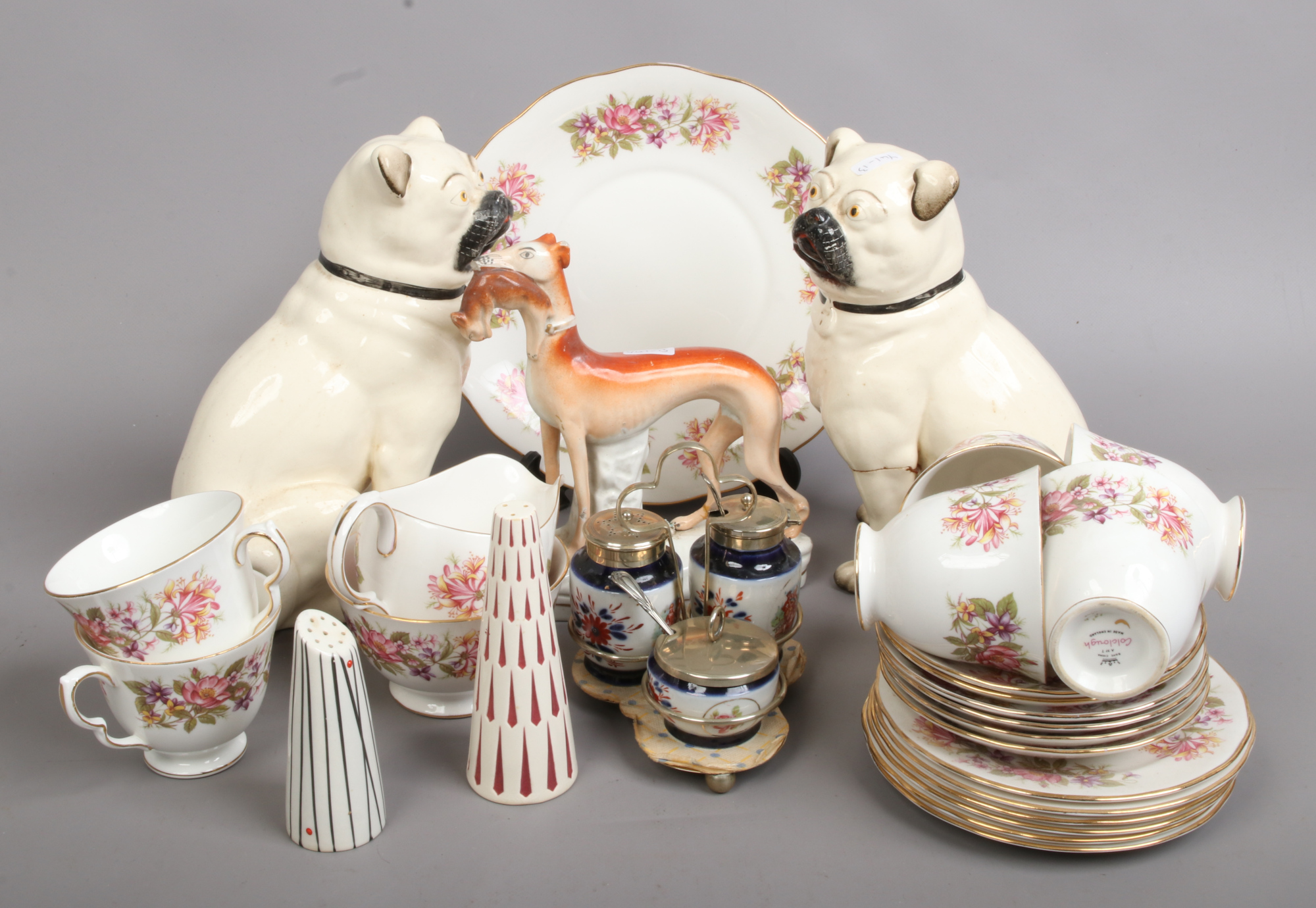 A collection of mixed ceramics including Staffordshire hare coursing hound, pug dogs and a Colclough