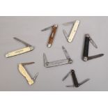 Seven folding pocket knives including stag antler scales and one decorated in relief with Venus.