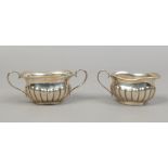 A matched silver cream jug and sugar bowl, assayed Birmingham 1901 and 1938, 217 grams.