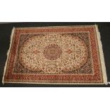A beige ground Keshan carpet, 230cm x 160cm.
