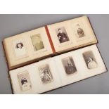 Two Victorian photograph albums and contents of vintage monochrome photos.