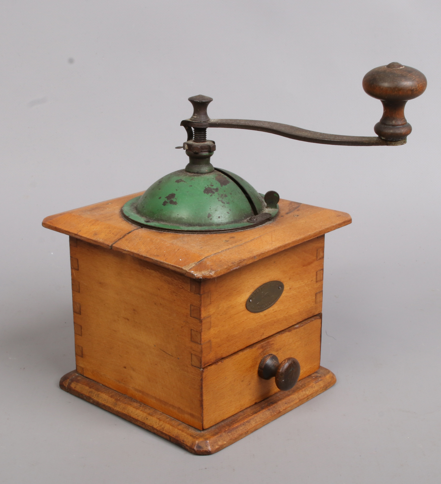 A vintage French coffee grinder.