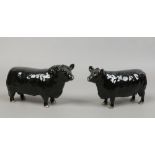 Two Beswick models of Aberdeen Angus cattle, cow and bull.
