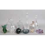 A group of mixed glassware to include cut glass decanters, controlled bubble ash tray, art glass