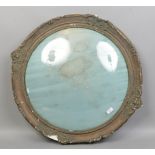 A late 19th century circualr gilt display frame with convex glass, aperture diameter 59cm.