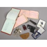 A group of collectables to include silver key, Webley starting pistol, coins, sketch books etc.