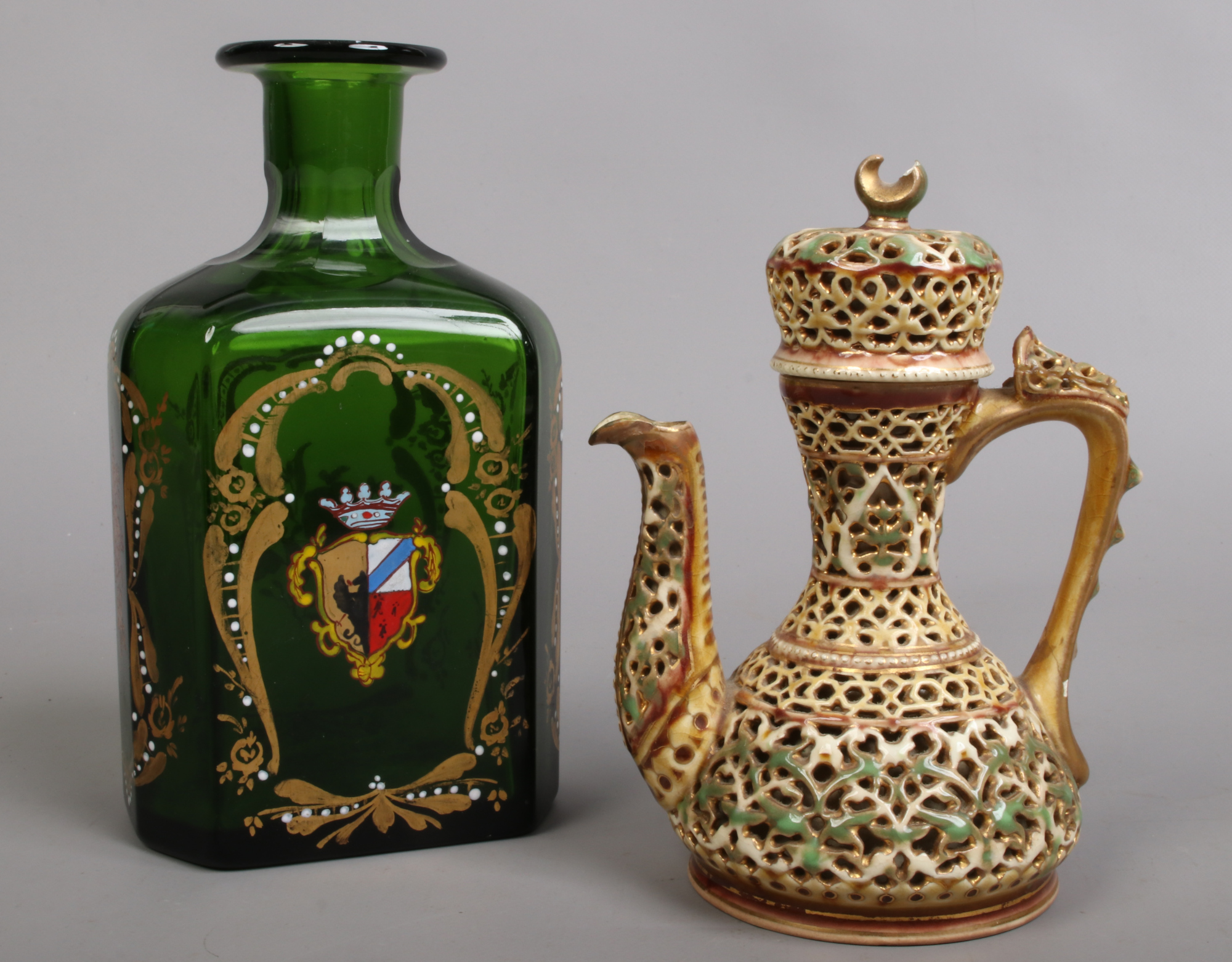 A 19th century Zsolnay Pecs reticulated ewer and cover in need of restoration, along with an