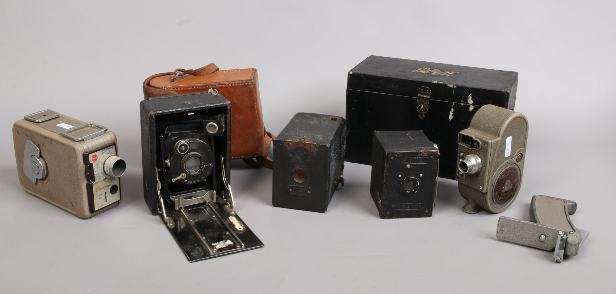 A Bell & Howell Sportstar Cine camera, Kodak Brownie Cine camera, two box cameras and a JCA German