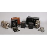 A Bell & Howell Sportstar Cine camera, Kodak Brownie Cine camera, two box cameras and a JCA German