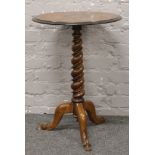 An inlaid bur walnut occasional table raised on a scroll support.Condition report intended as a