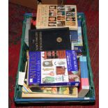 A box of books to include antique price guides, Harry Potter, The Peter Pan picture book etc.