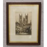 A large framed etching of Lincoln Cathedral.