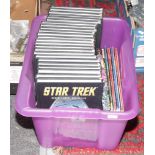 Twenty three volumes of Star Trek graphic novel collection, along with a selection of Wolvering,
