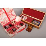 Two jewellery boxes including a wood effect example and contents of costume jewellery.