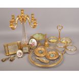 A quantity of decorative cut glass and gilded metal items including a four branch candelabra, mantle