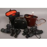 A collection of binoculars including cased Carl Zeiss Dekarem 10 x 50 Boots Admiral II and Lamont