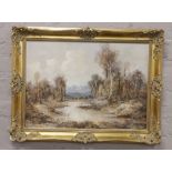 W. Bauld, a gilt framed oil on canvas, river landscape with mountains in the distance, 49.5 x 69.