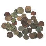 A collection of antique bronze coins, possibly Roman.