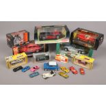 A collection of Diecast model cars in original boxes by Kyosho, Maisto and Britain's, along with