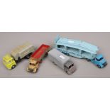 A Dinky Diecast Pullmore car transporter, two Dinky Bedford lorries and a Dinky refuse wagon.