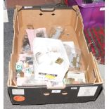 A box of locks, padlocks and brass hinges.