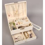 A jewellery box with contents of costume jewellery to include rings, bangles, earrings, necklaces