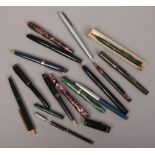 A collection of nine fountain pens some with 14ct gold nibs, along with a collection of ball point