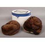 Two vintage ladies mink fur hats in oval hat box.