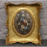 An ornate gilt framed oil still life, under convex glass, signed Taray.