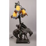 After Ferdinand Lugerth, a composite figural table lamp of a soldier on horseback and lover.