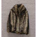 A ladies goat fur jacket size 14.