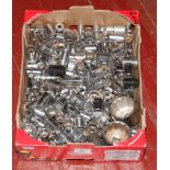 A box of various sized ratchet sockets.