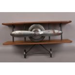 A unusual biplane wall shelf.