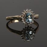 A gold aquamarine and diamond cluster ring (tested gold) size O.