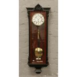 An early 20th century single weight Vienna wall clock with enamel dial and subsidiary seconds.