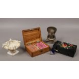 A miniature alabaster font signed Isola Bella, a stone Buddha, Cantonese silk mounted box and a