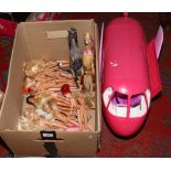 A box of Barbie dolls and accessories.