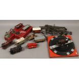 A collection of o gauge Hornby railway to include three clock work locomotives, track, carriages