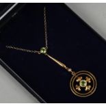 A 9ct gold seed pearl and peridot pendant necklace.